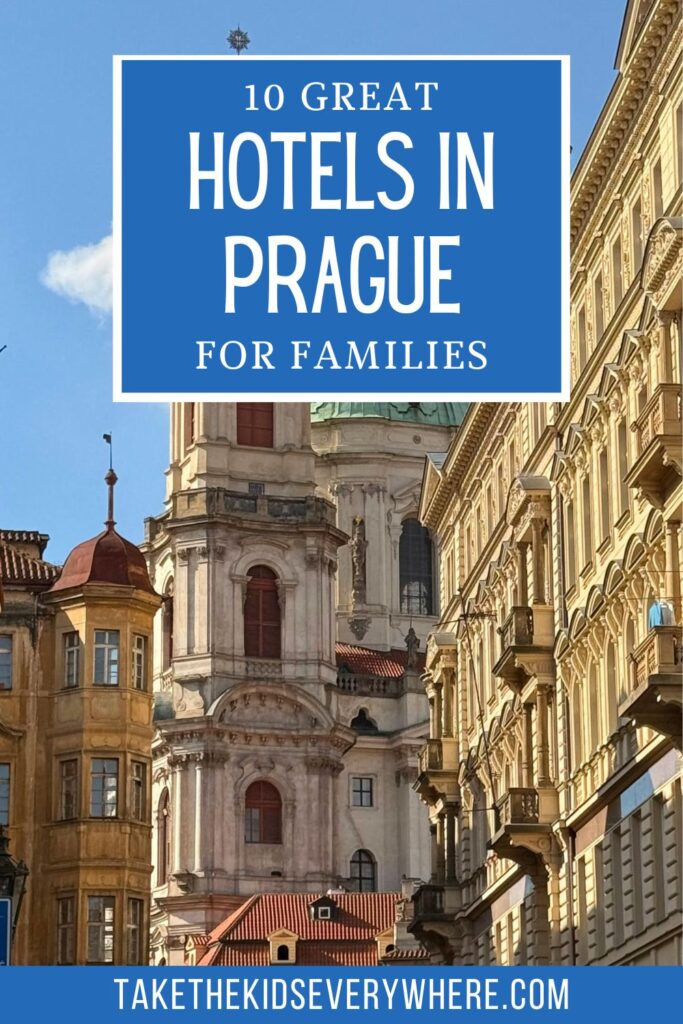 Historic buildings and a church tower line a narrow street in Prague beneath a clear blue sky. The graphic includes the text “10 GREAT HOTELS IN PRAGUE FOR FAMILIES” and “takethekidseverywhere.com.”