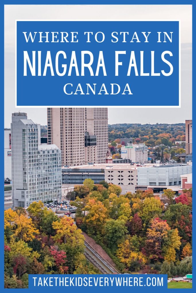 An aerial autumn view of the Niagara Falls, Ontario hotel district with colourful fall foliage, overlaid with the text "Where to Stay in Niagara Falls, Canada.