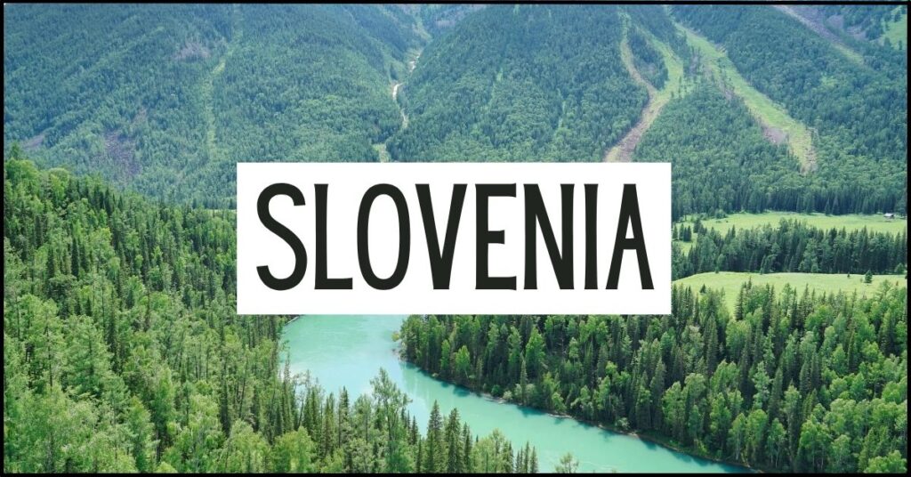 Turquoise river winding through a dense evergreen forest with green mountains stretching into the distance. Large white text overlay reads "SLOVENIA".